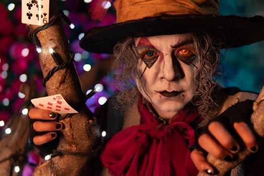 Creative cosplay character portrait with vibrant makeup and Tim Burton style elements.