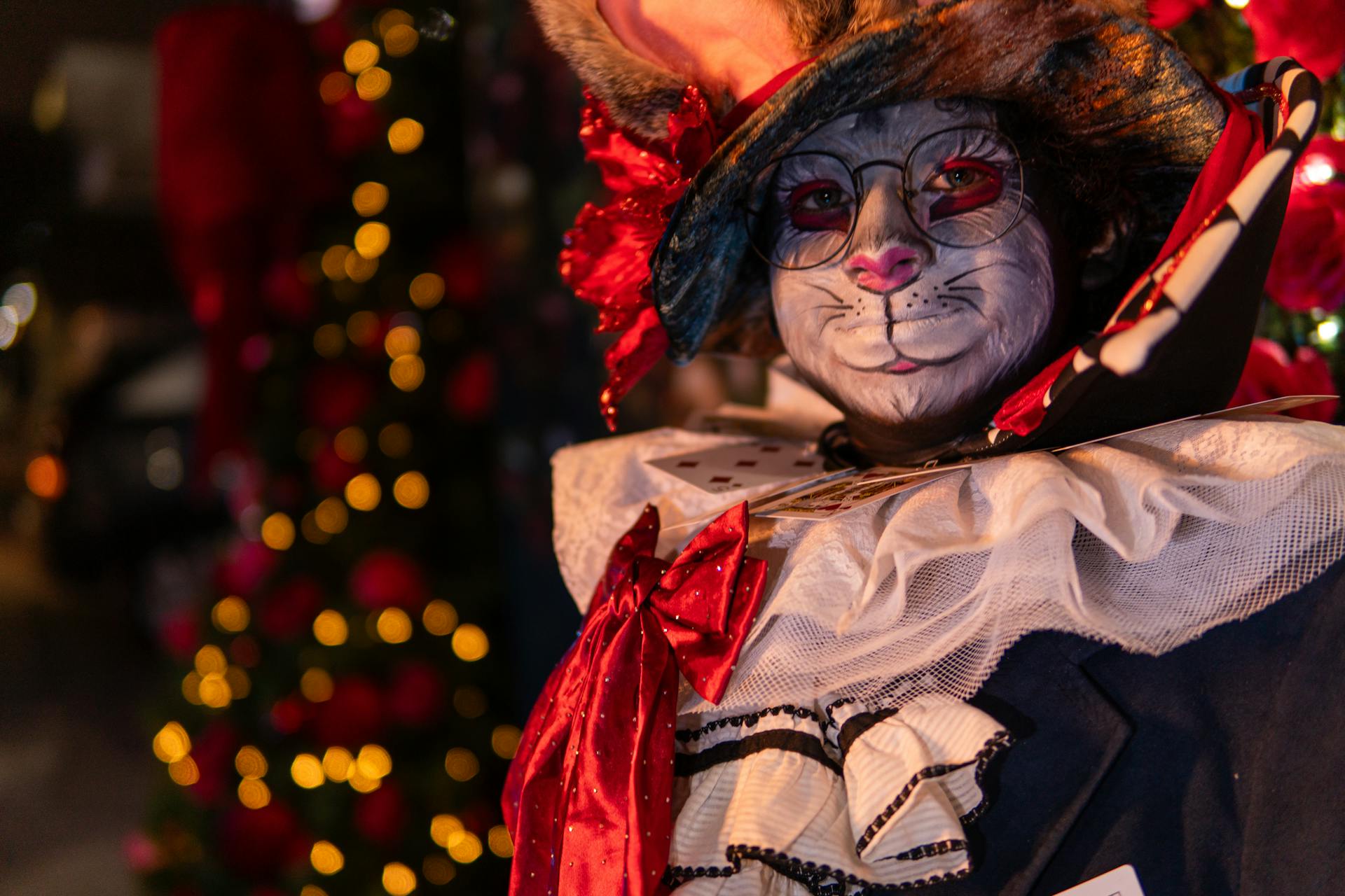 Colorful rabbit-inspired cosplay with intricate makeup and costume, reminiscent of wonderland themes.