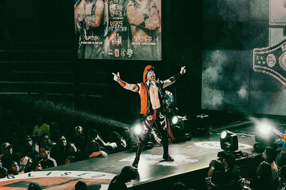 A vibrant luchador performs on stage in a lively wrestling event, thrilling a packed audience.