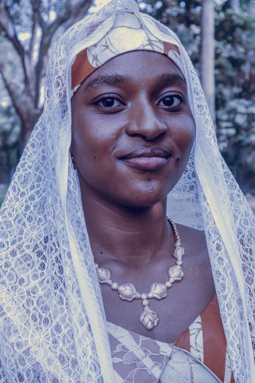 Free Close-up portrait of an adult woman wearing traditional attire and jewelry outdoors. Stock Photo