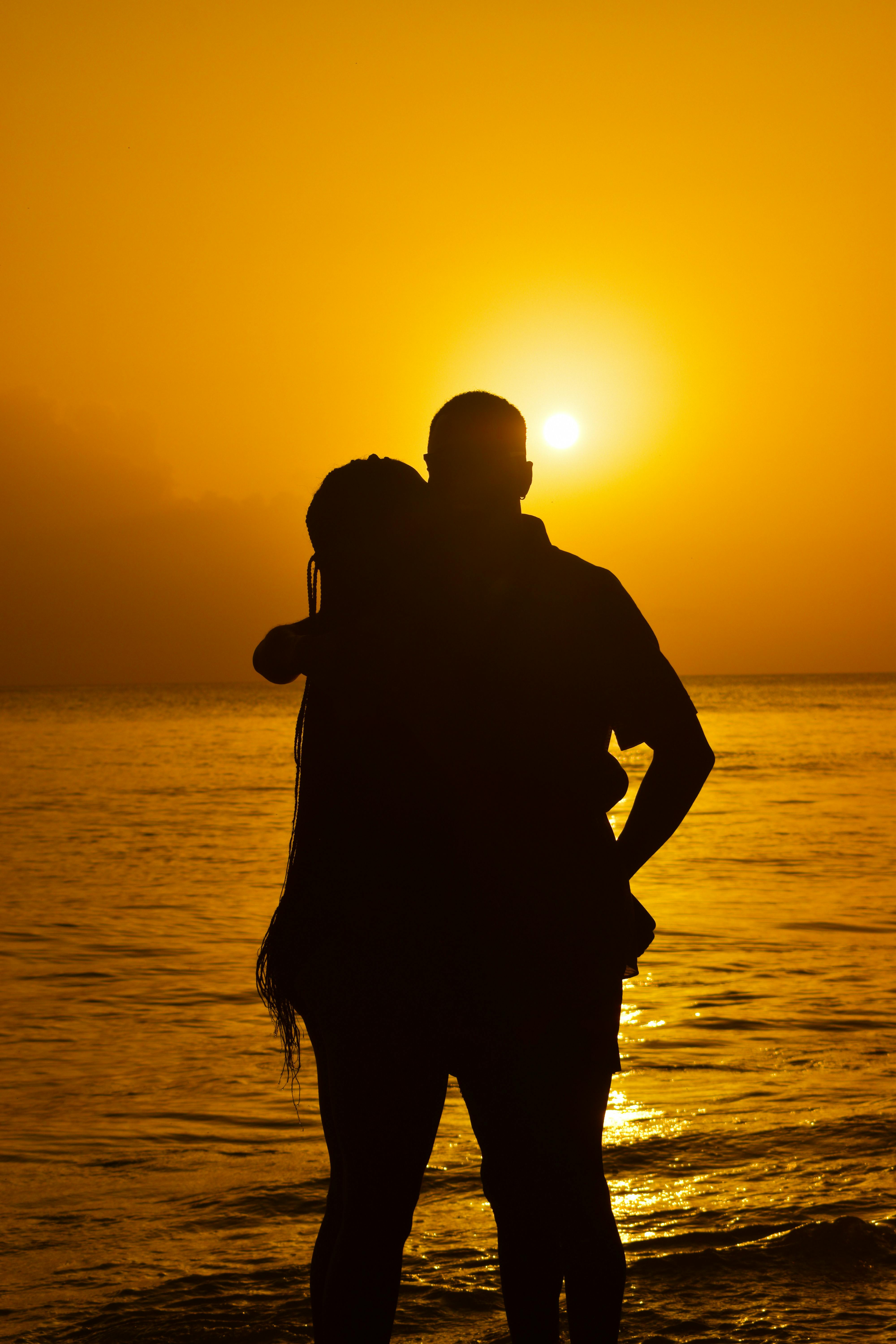 romantic beach sunset silhouette of a couple