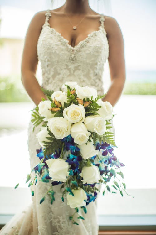 Woman Holding White Flower Bouquet