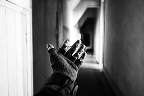 Monochrome Photo of Person's Hand