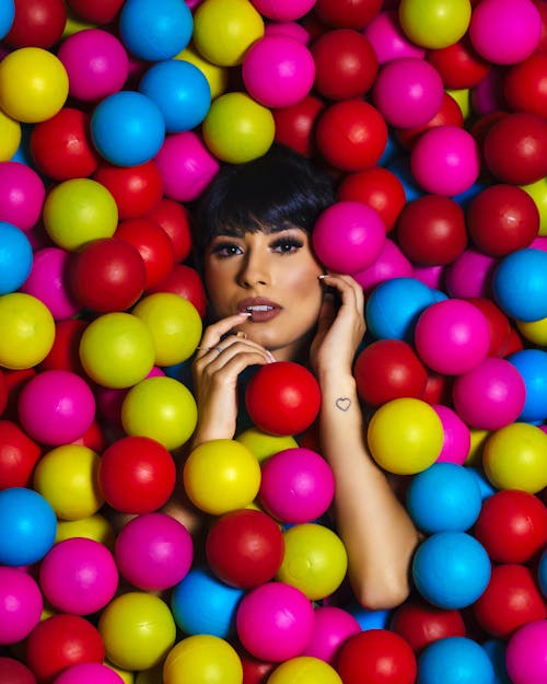 Woman Surrounded With Multicolored Balls