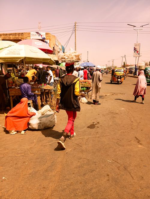 Free Vibrant street market scene in Zaria, Nigeria, capturing local vendors and shoppers in action. Stock Photo