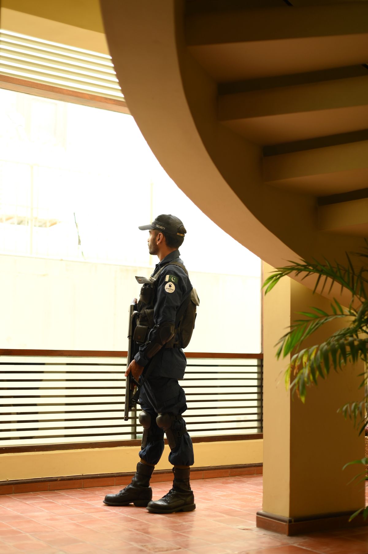 Security guard monitoring a commercial building interior