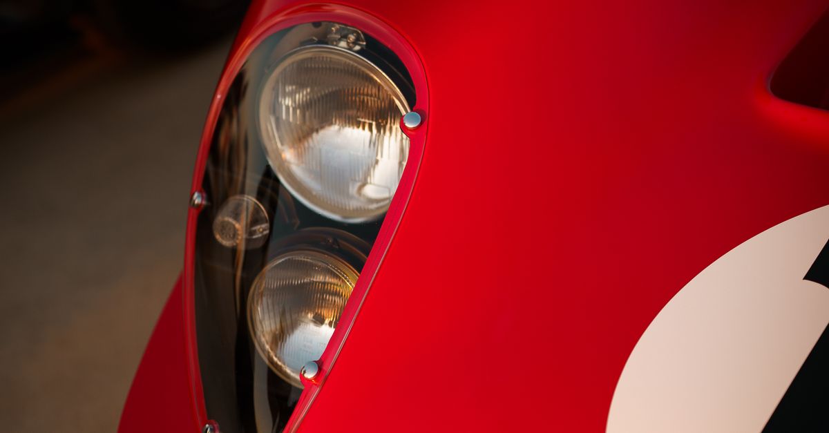 Close-up of Classic Red Race Car Headlight · Free Stock Photo