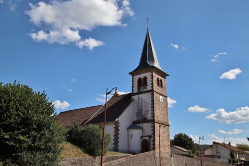 Free Beautiful historic church in Charmes-sur-Rhône against a clear blue sky with fluffy clouds. Stock Photo