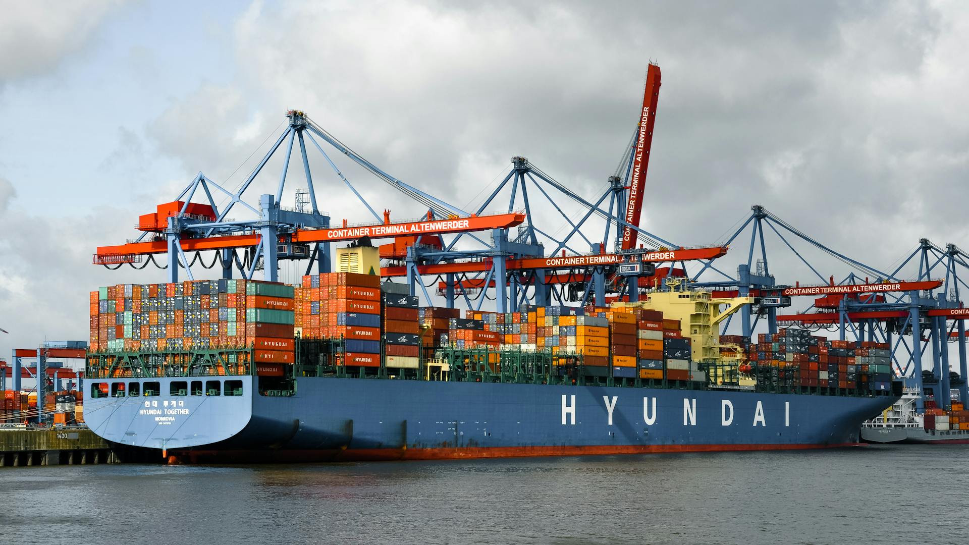 Large container ship docked at Hamburg port, Germany's key trade hub.