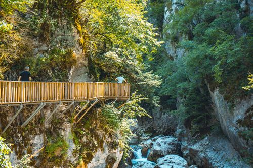 Free Two people on a wooden bridge in a lush Kastamonu gorge. Stock Photo