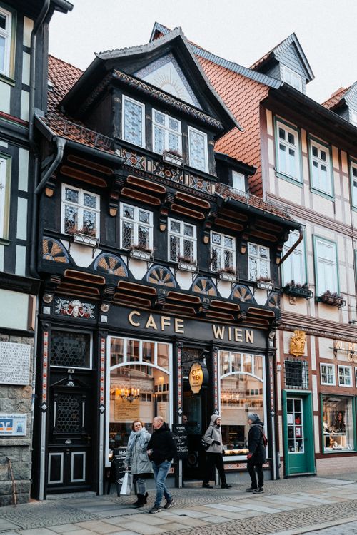 Free Historic Cafe Wien with charming Fachwerk architecture in Wernigerode, perfect for travel exploration. Stock Photo
