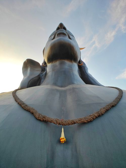 Free Close-up view of a majestic Shiva statue with a serene sky backdrop. Stock Photo