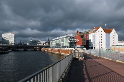 Free Panoramic view of HafenCity architecture under dramatic clouds in Hamburg, Germany. Stock Photo