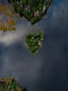 Aerial View of Lush Green Island in Calm Lake