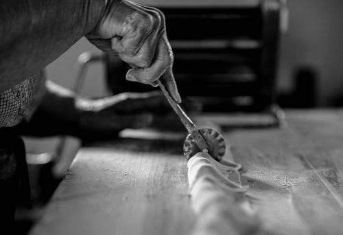 Free Close-up of hands crafting pasta, emphasizing technique and tradition. Stock Photo