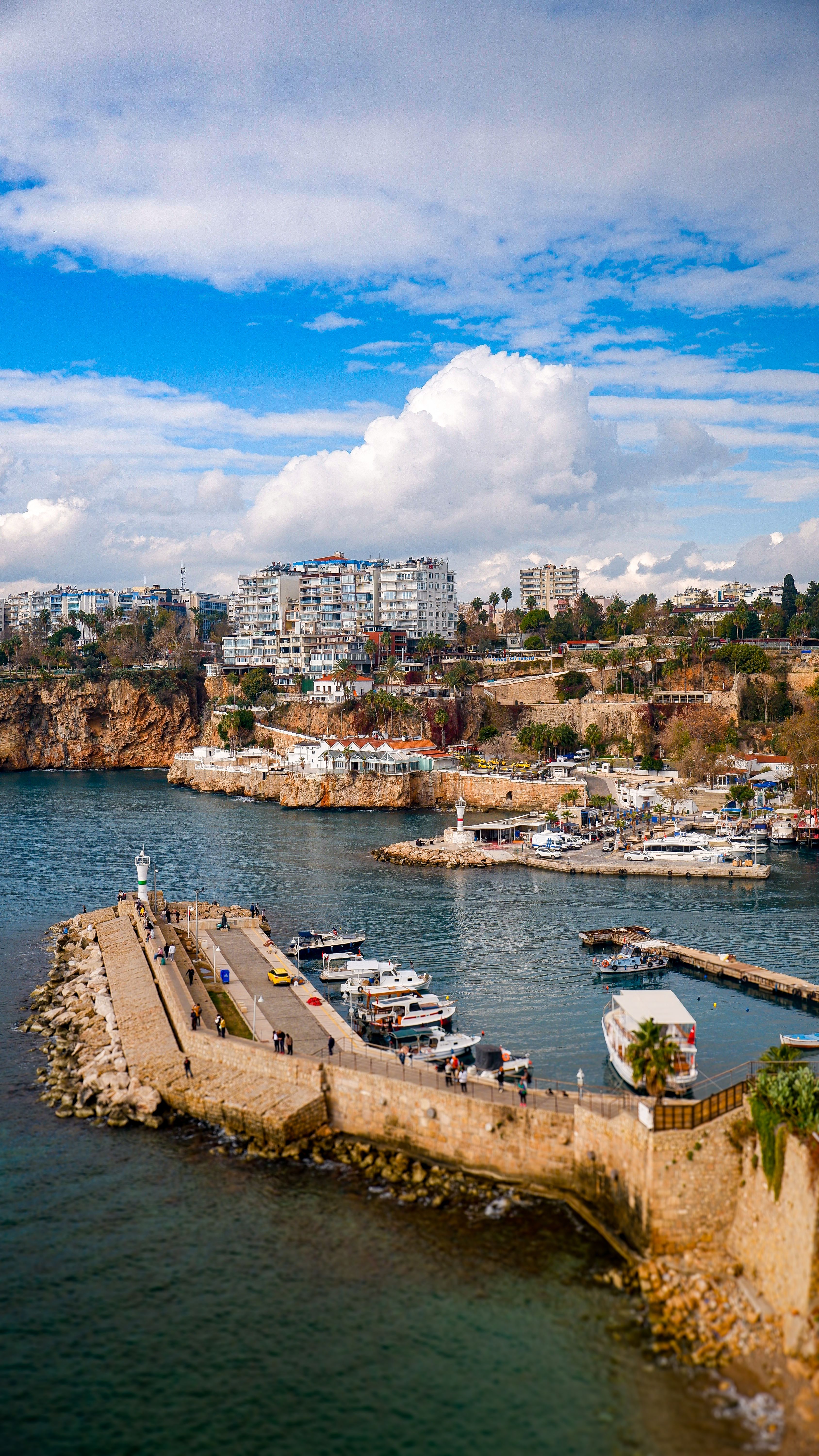 Beautiful aerial view of Antalya's marina and coastline under a vibrant blue sky.