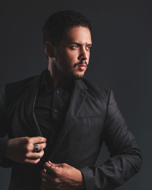 Free Sophisticated portrait of a man in a stylish dark suit with a thoughtful look. Stock Photo