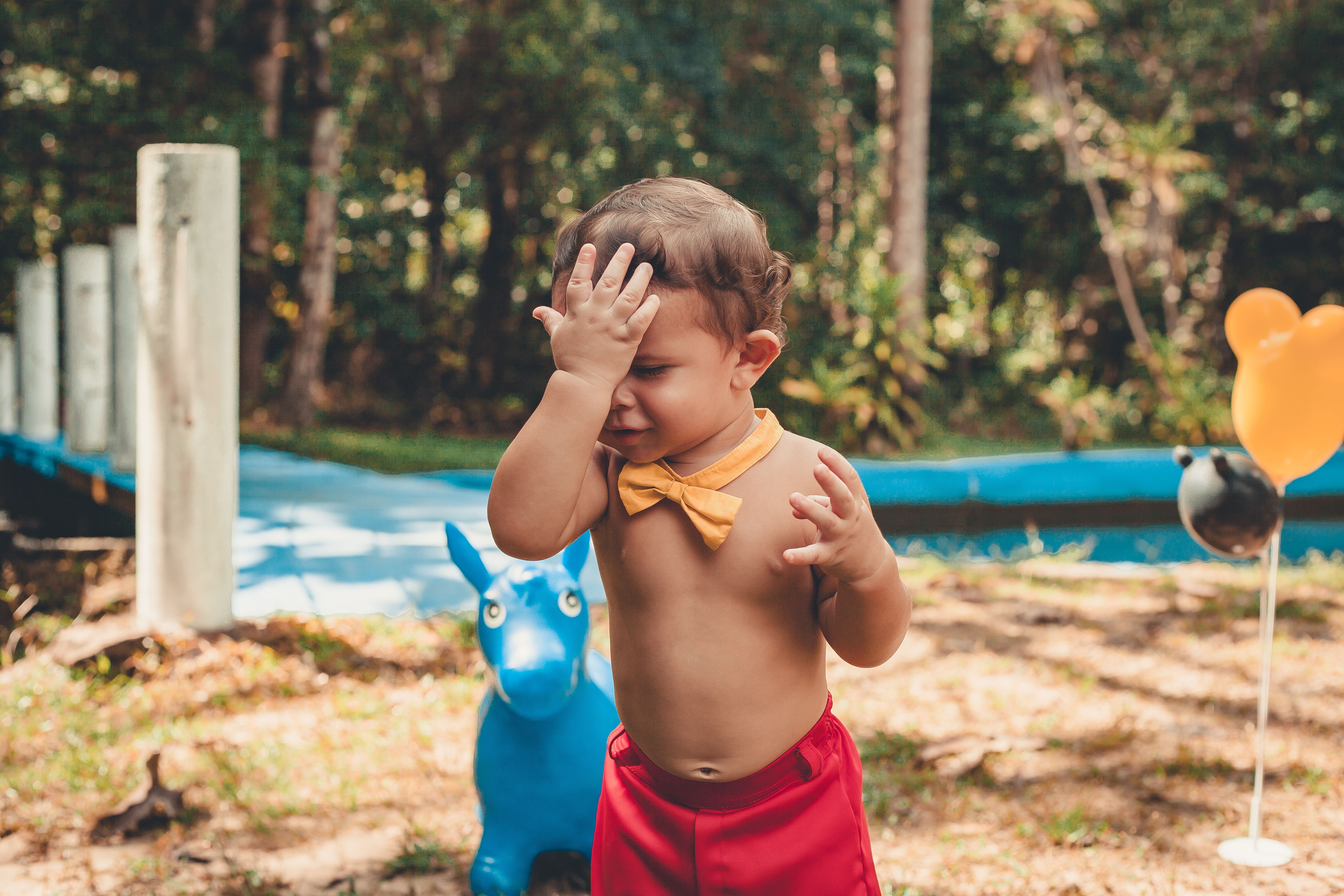 Little Wearing Red Shorts and Yellow Bow Tie