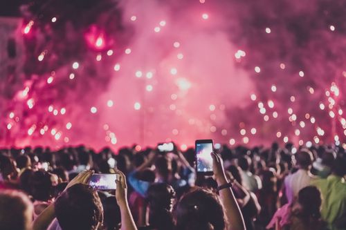Free Crowd capturing live fireworks at night festival, showcasing vibrant energy and celebration. Stock Photo