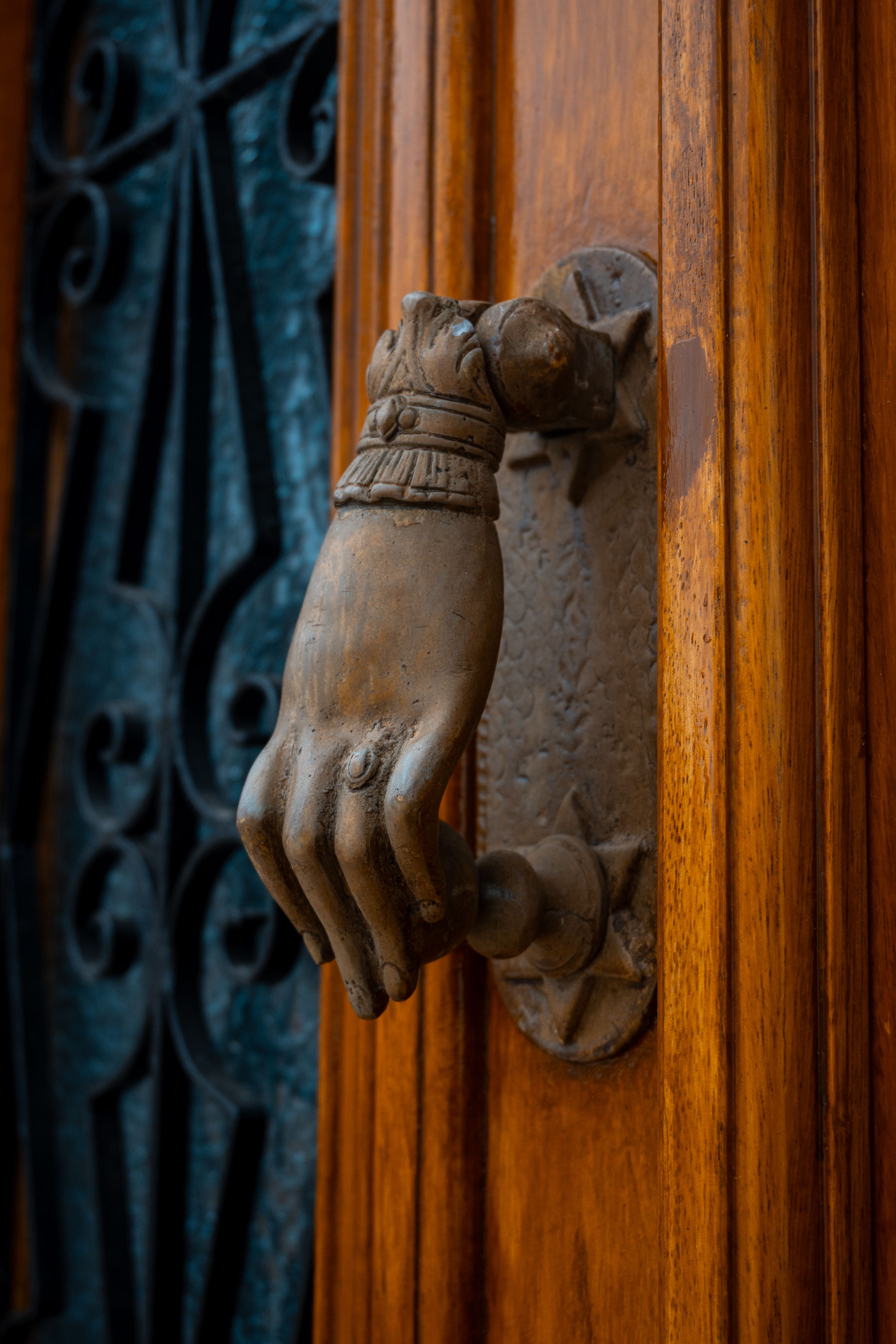 Antique Hand Door Knocker on Wooden Door · Free Stock Photo