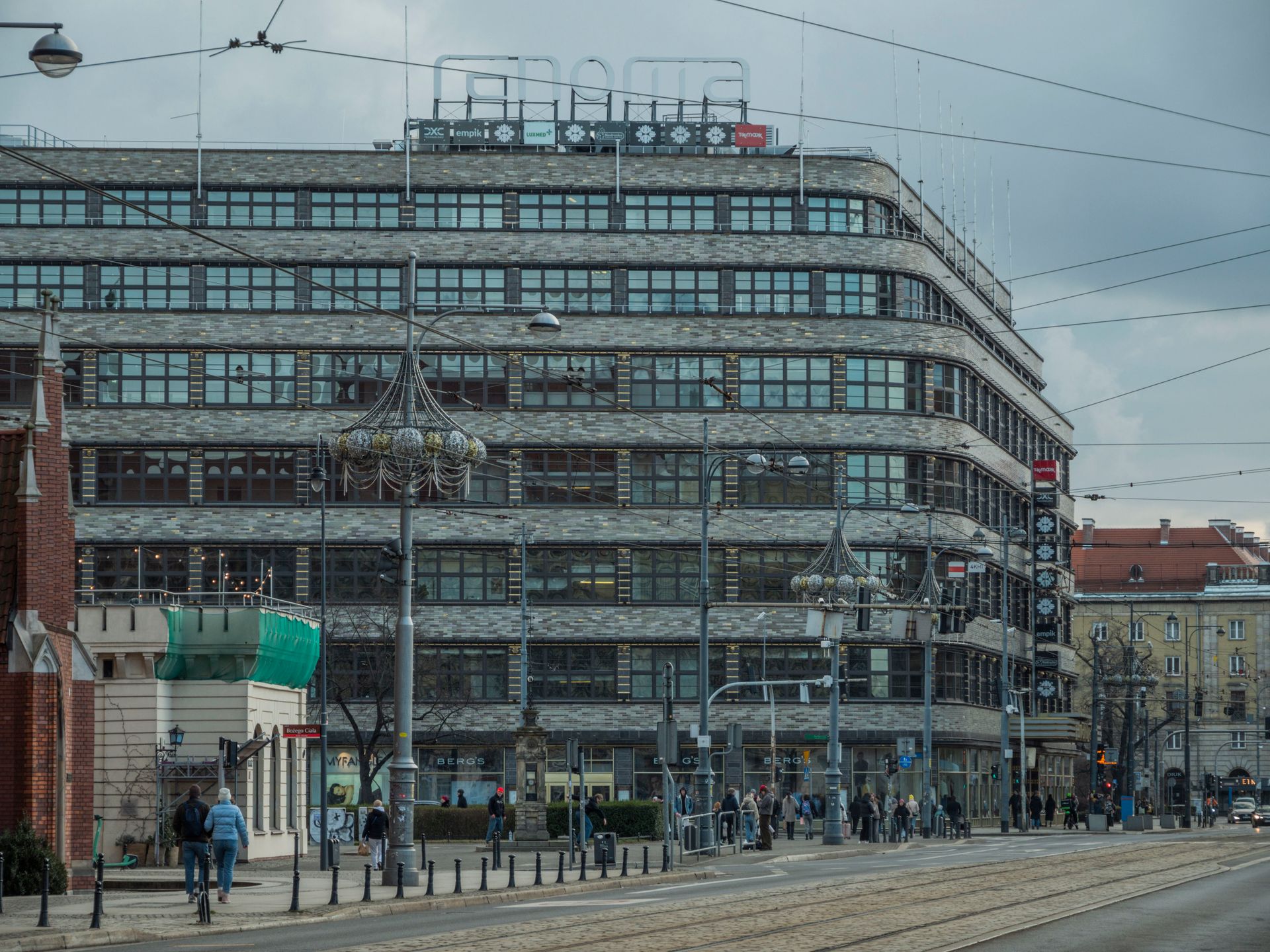 View of Renoma, a historic department store in Wrocław, showcasing city's urban architecture.