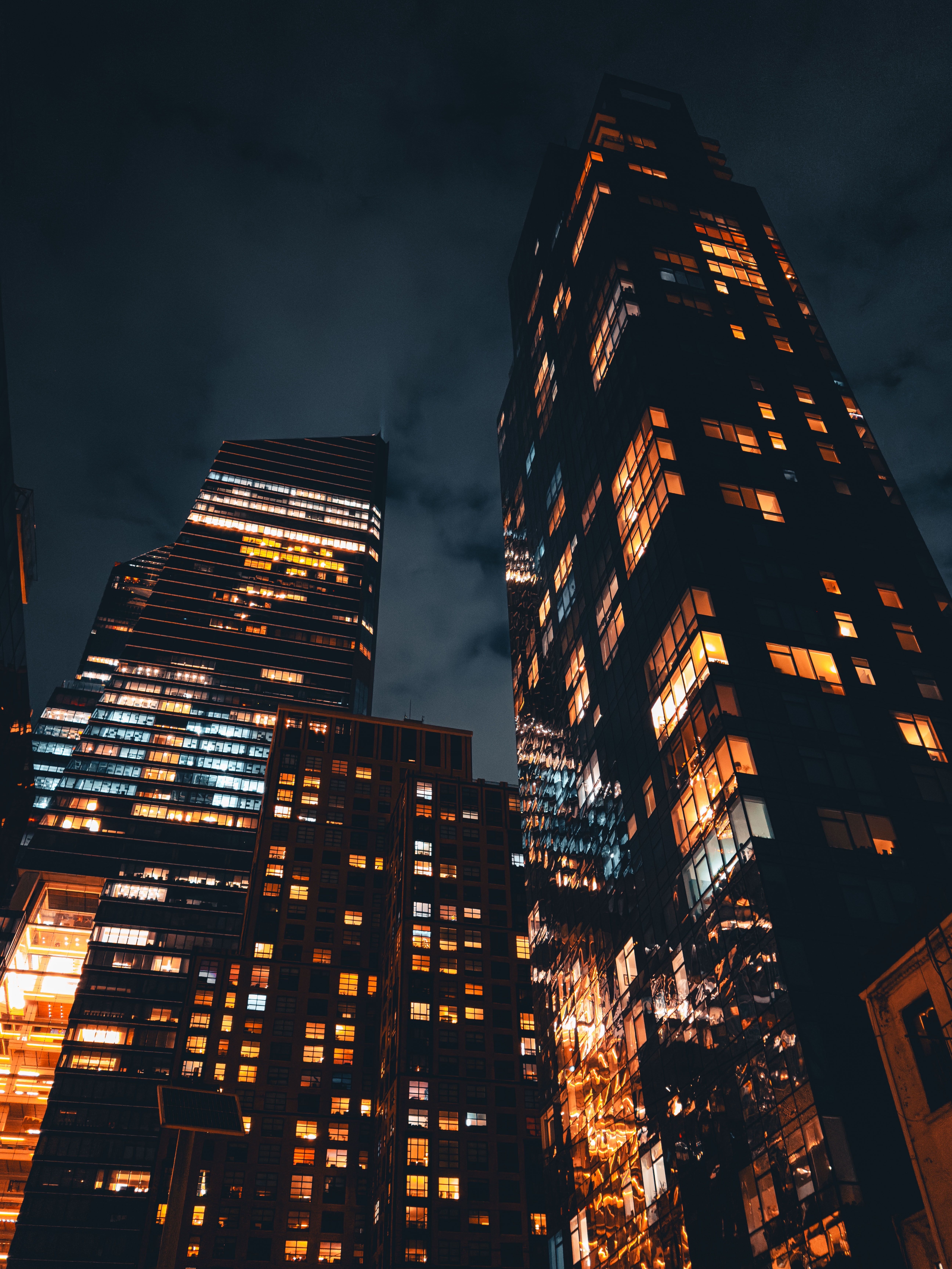 Office towers lit after dark, by Allen Boguslavsky on Pexels