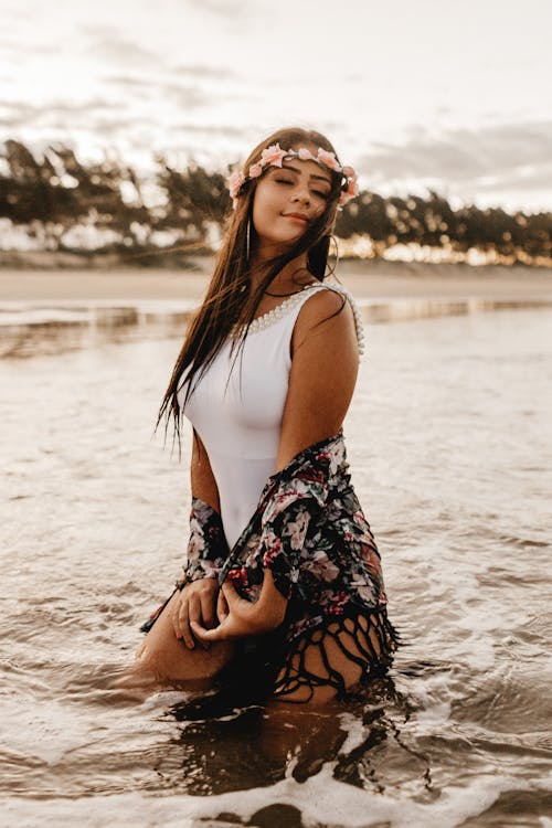 Free Woman Wearing Flower Crown and White Swimsuit Stock Photo