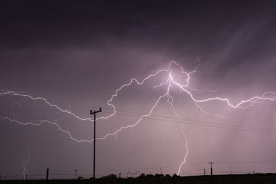 Dramatic lightning storm over power lines