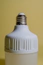Modern Minimalist LED Light Bulb against Yellow