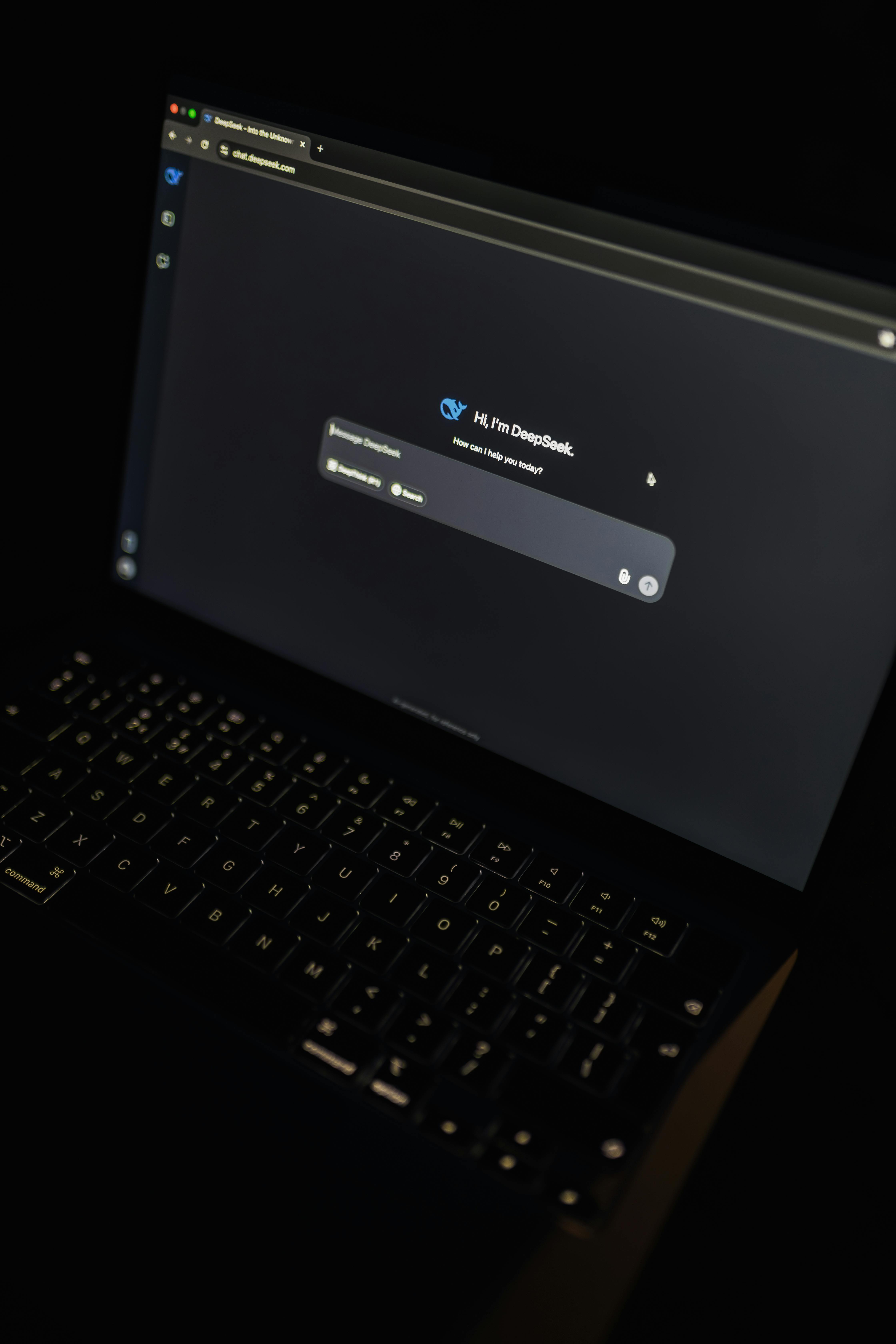 laptop screen displaying ai interface at night