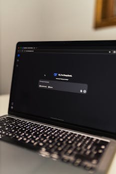 Photo by Matheus Bertelli Close-up view of an AI chat interface on a laptop screen in a dimly lit room.