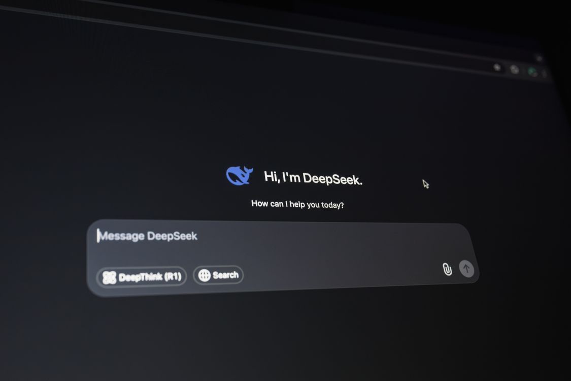 AI interface glowing on a dark screen, displaying a chat-based AI assistant