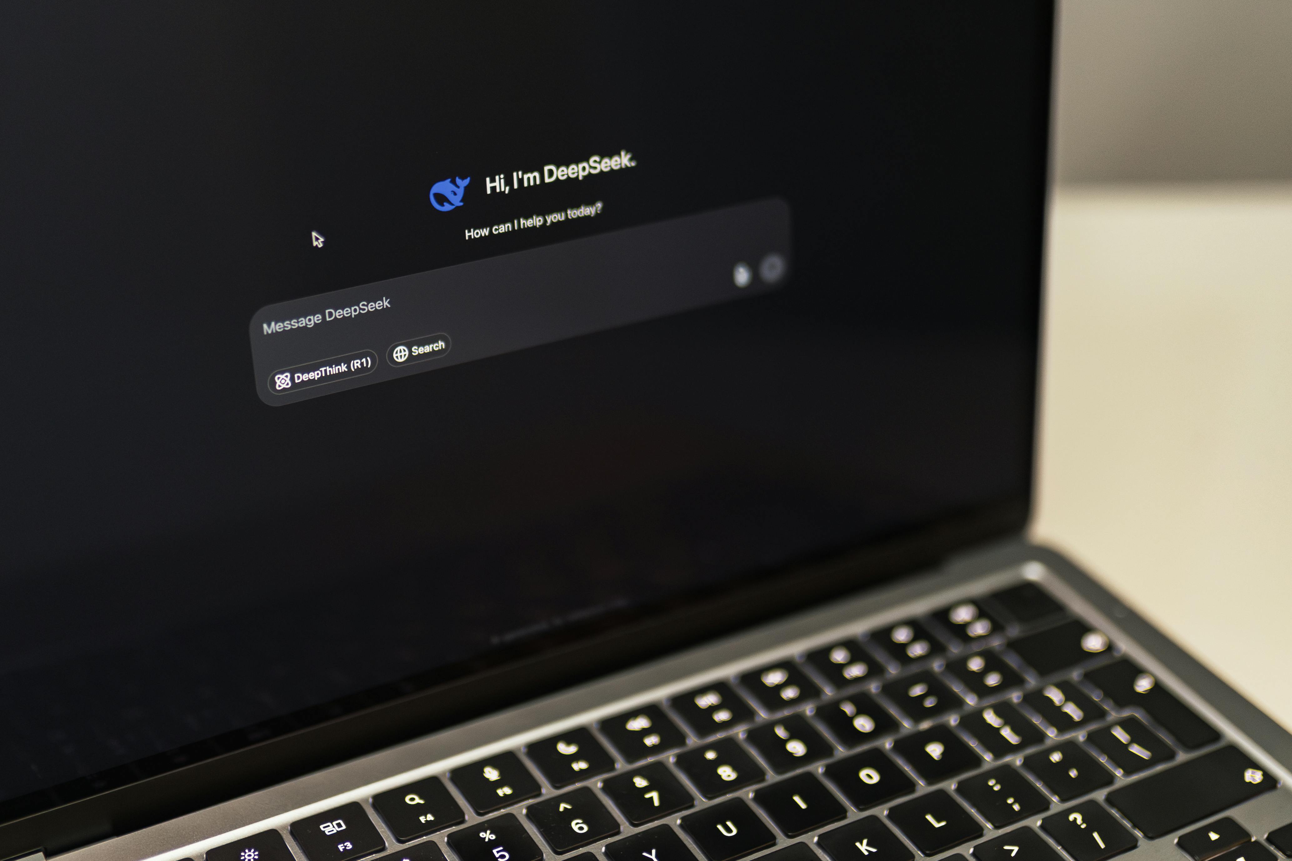 macbook with deepseek ai interface displayed