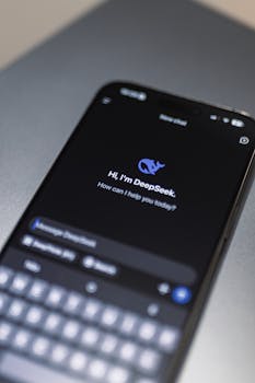 Close-up of smartphone screen showing AI app DeepSeek interface on dark background.