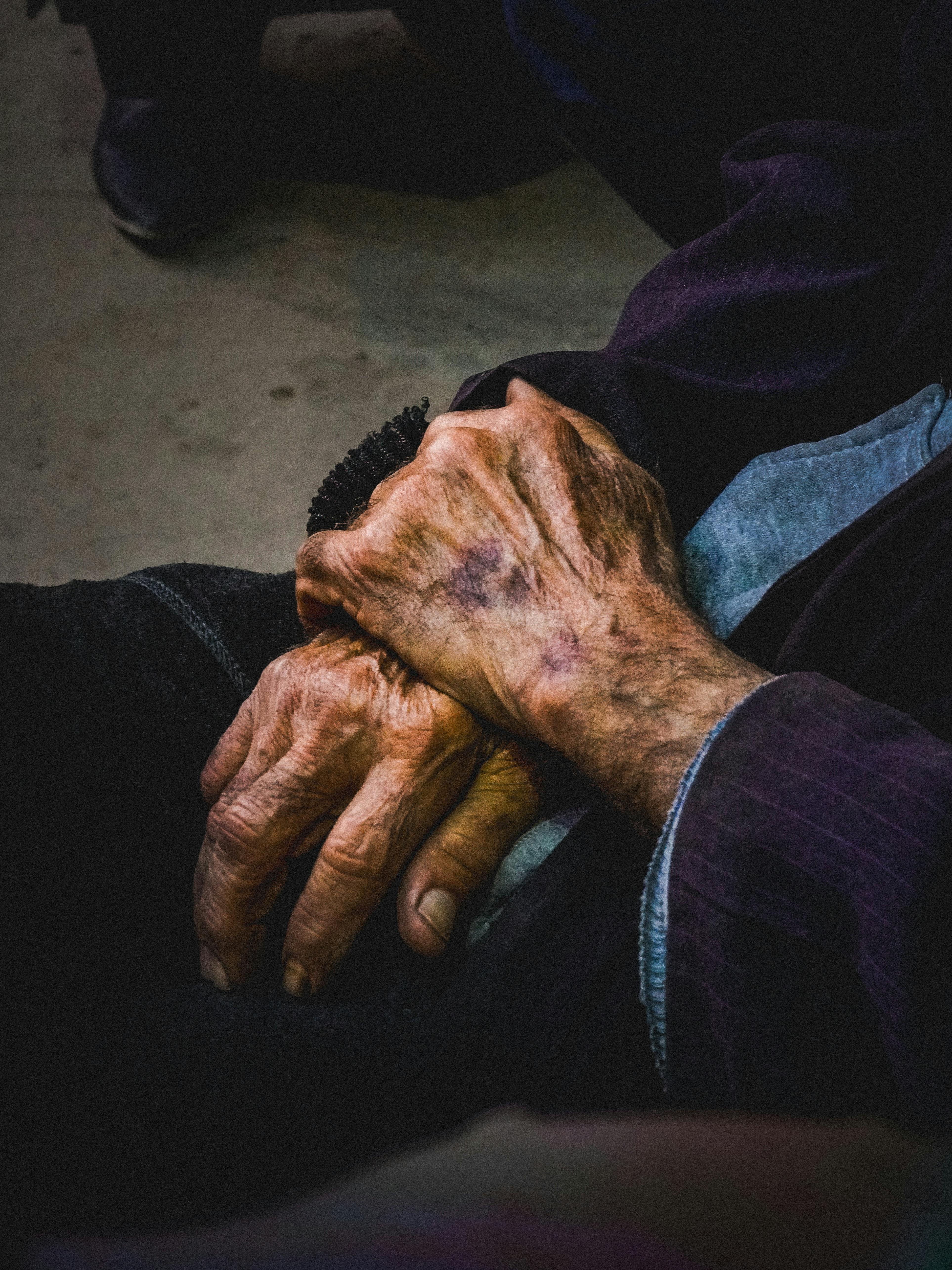 Close-up of an elderly person's hands, conveying wisdom and life experience.