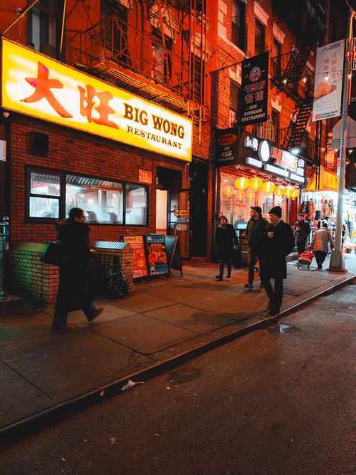 Free Lively scene in Chinatown with neon lights and bustling nightlife. Stock Photo
