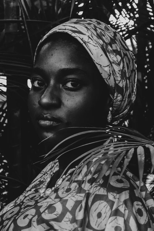 Free Striking black and white portrait of an adult woman surrounded by nature. Stock Photo