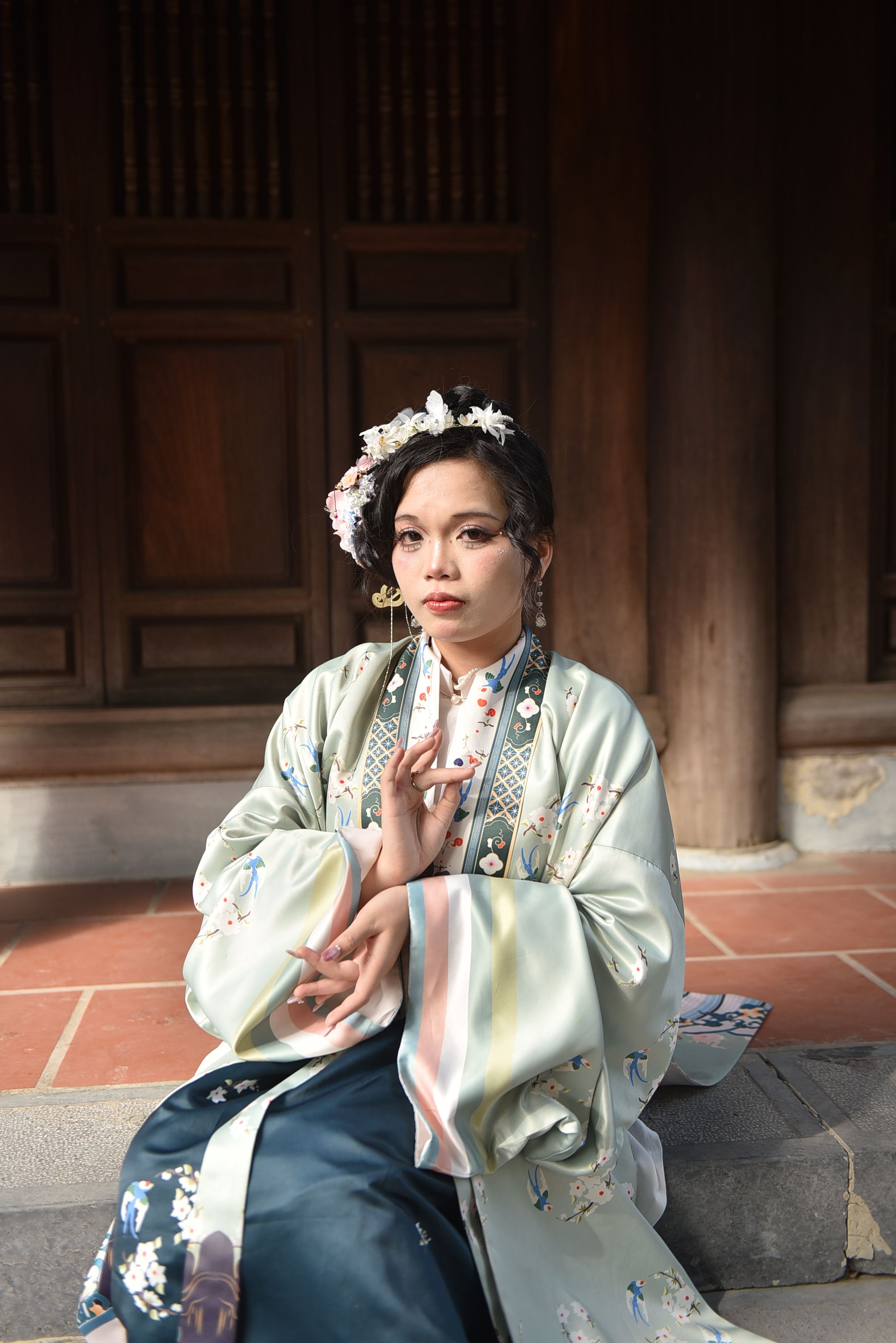 Elegant Woman in Traditional Asian Attire Indoors · Free Stock Photo
