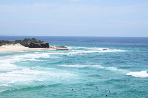 Free surfers on a clear blue ocean Stock Photo