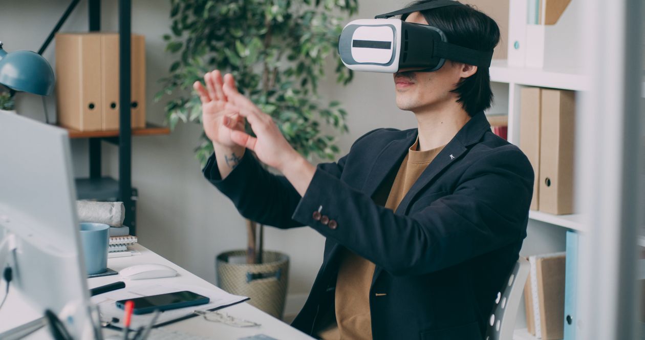Professional using a VR headset in an office