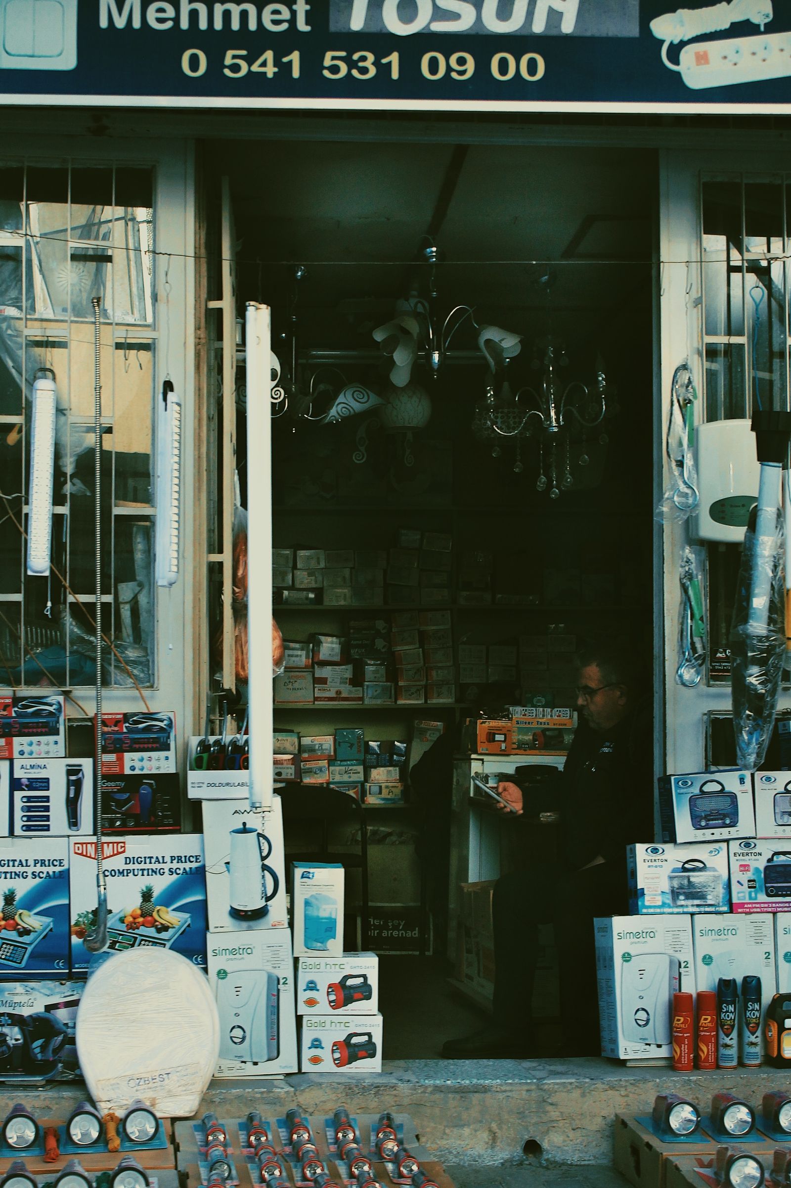 Retail store floor with household goods and appliances displayed at the entrance