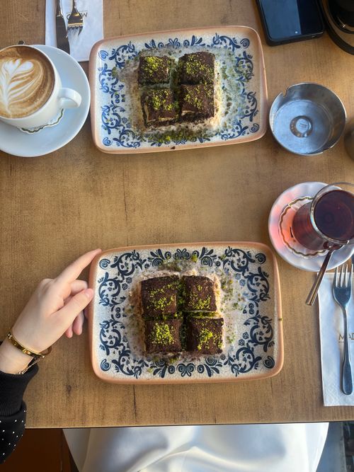 Free A top view of a table with Turkish dessert, coffee, and tea, capturing a traditional Istanbul café setting. Stock Photo