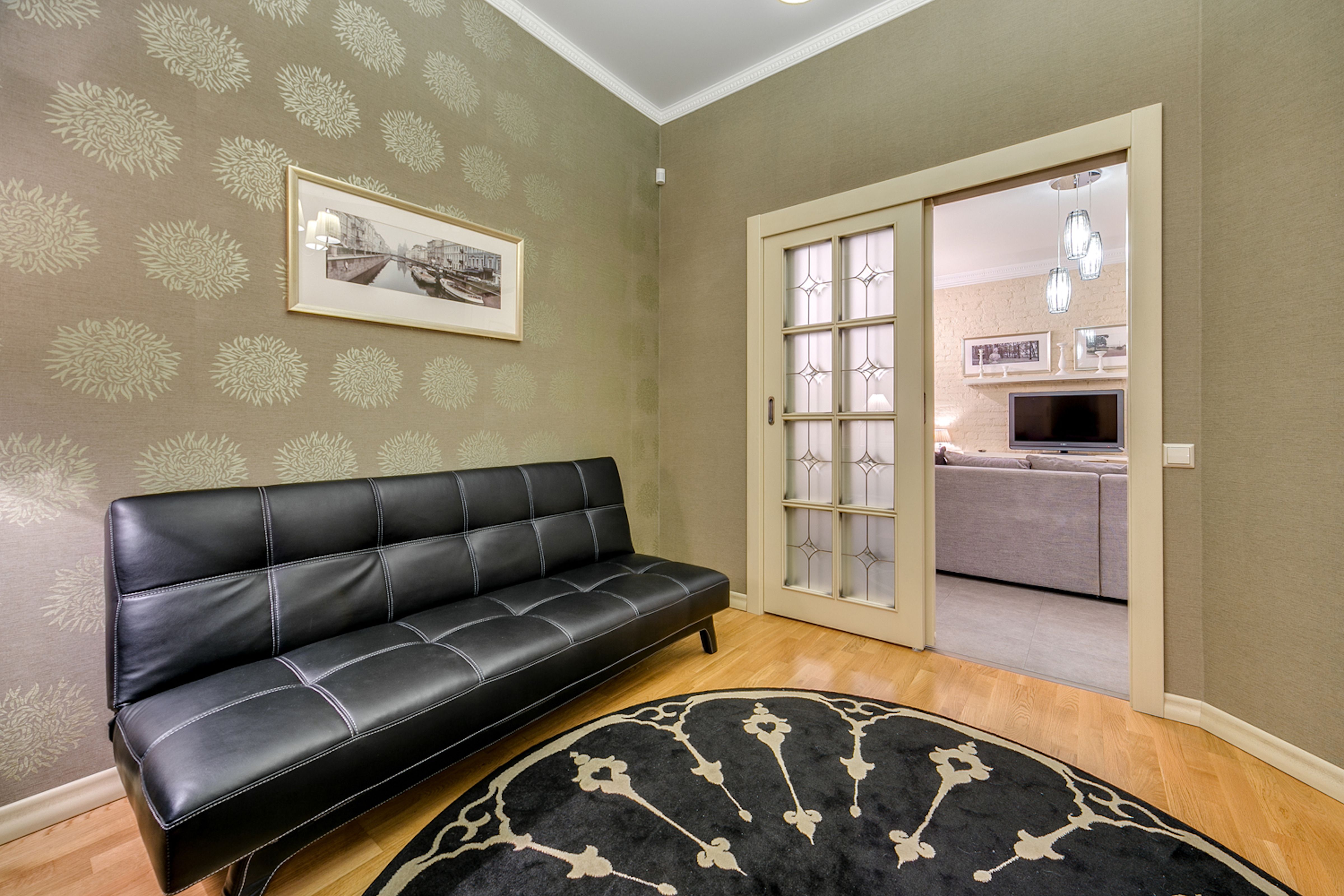 Modern Living Room with Stylish Black Sofa and Decor · Free Stock Photo