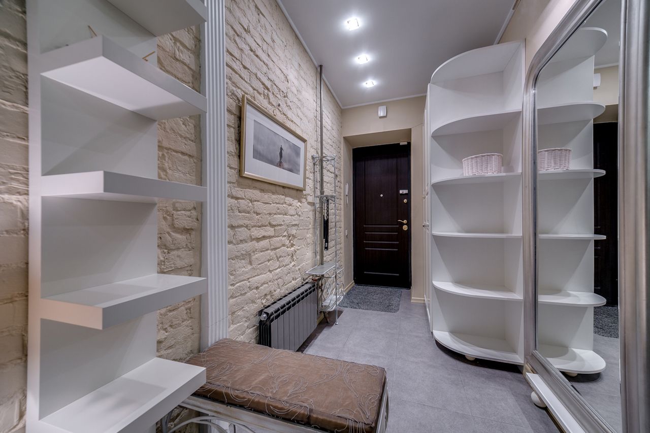 An entry bench with shoe storage under it