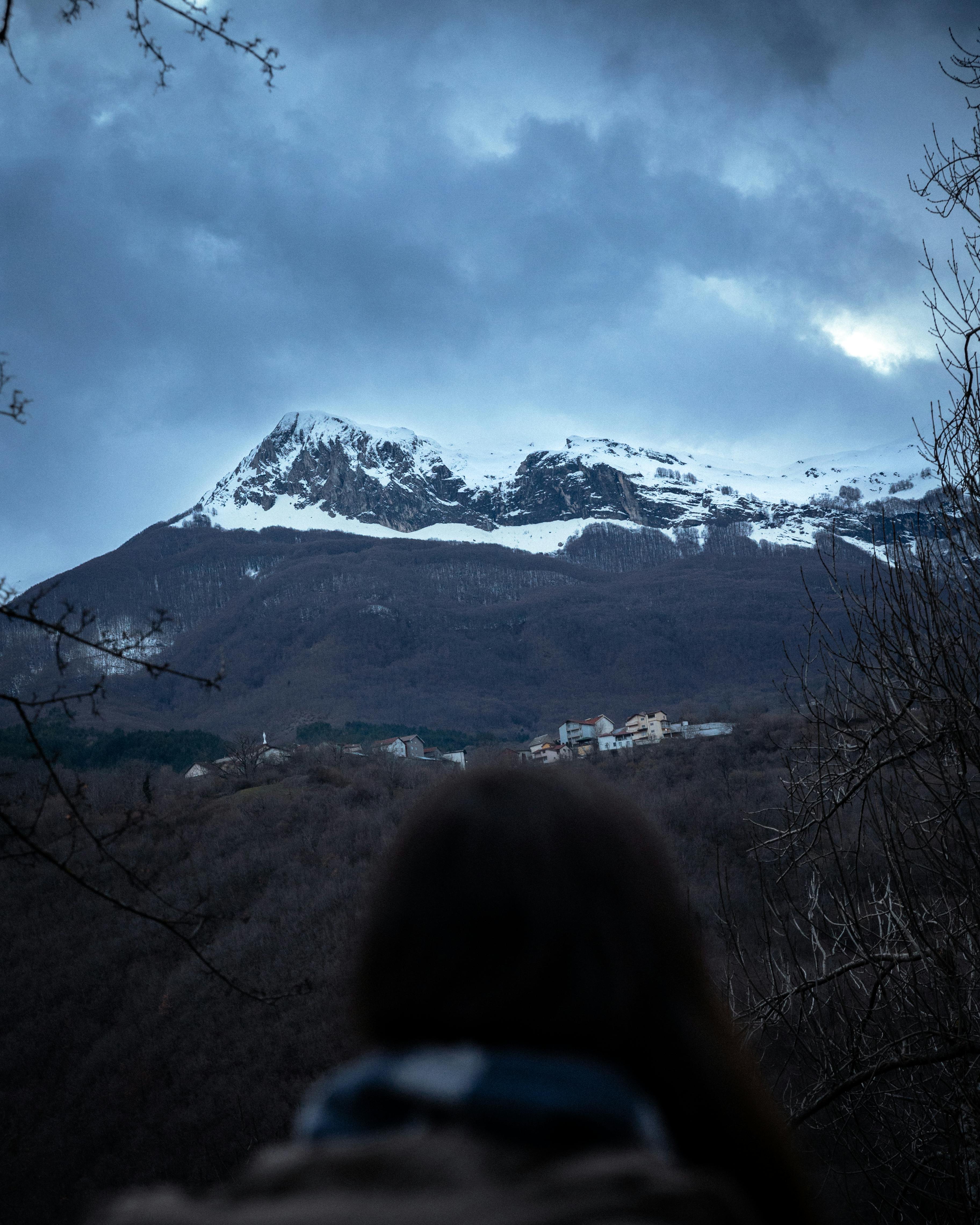Snow-capped mountains under dramatic sky in Radostusha, North Macedonia.