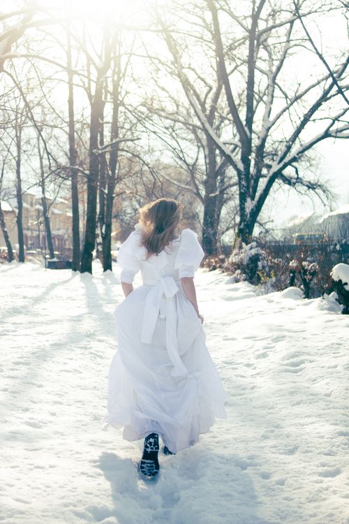 Woman in White Dress Walking Through Snowy Winter Scene Free Stock Photo Woman in White Dress Walking Through Snowy Winter Scene Free Stock Photo