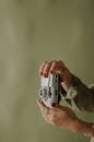 Close-up of Hands Holding Vintage Camera