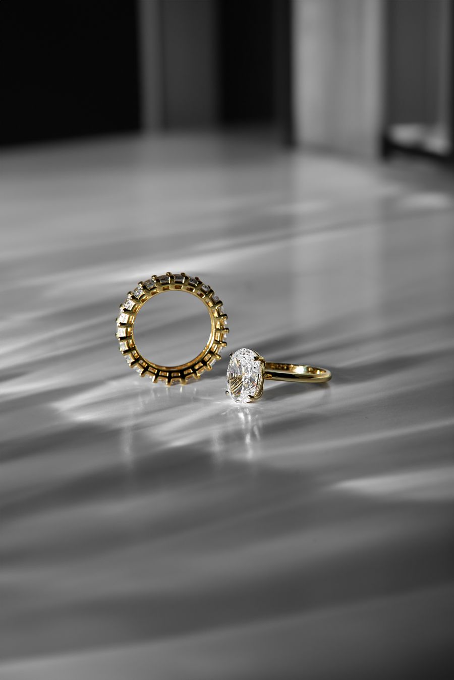 Gold and diamond rings in sculpted light