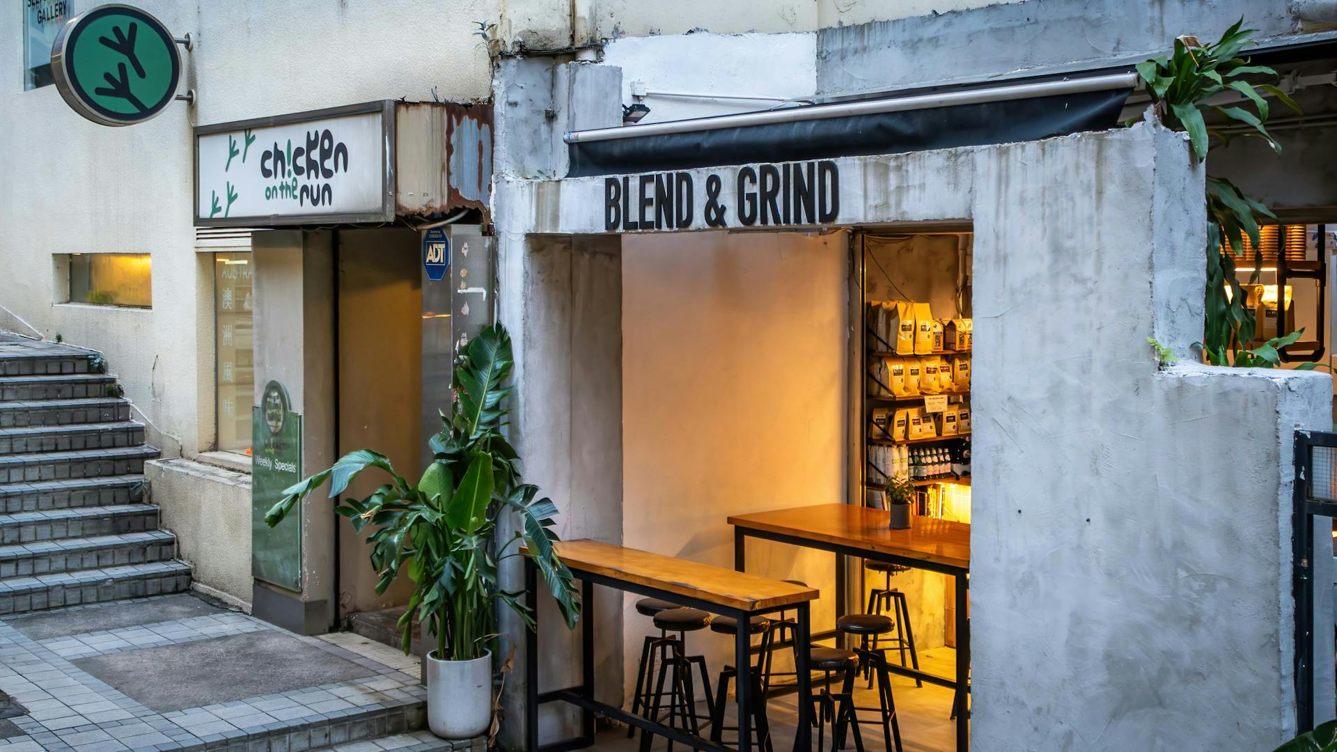 Rustic coffee shop and fast food eatery blend in a charming Hong Kong street corner.