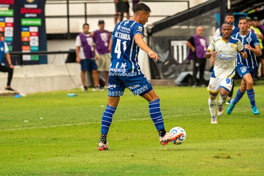 Intense soccer match capturing players in action on the grass field.